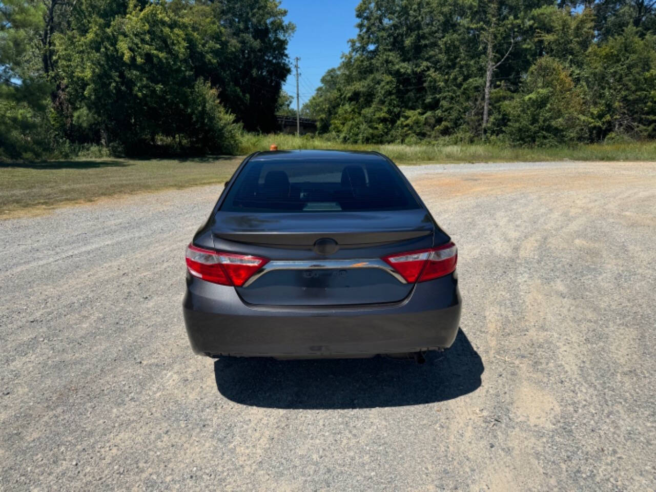 2016 Toyota Camry for sale at Guadalupe Auto Sales, LLC. in Jemison, AL