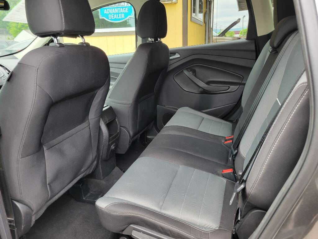 2015 Ford Escape for sale at DAGO'S AUTO SALES LLC in Dalton, GA