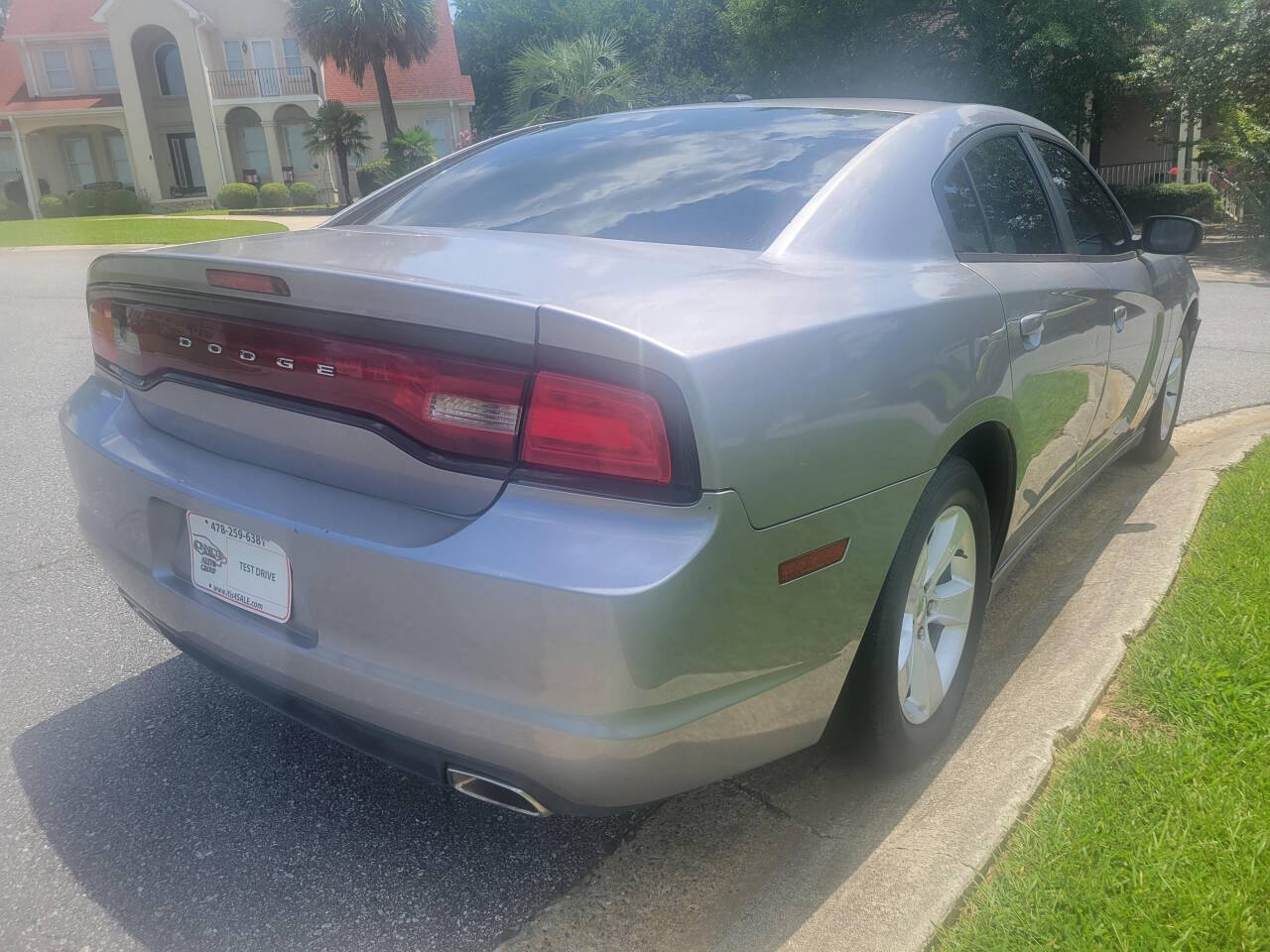 2014 Dodge Charger for sale at Connected Auto Group in Macon, GA