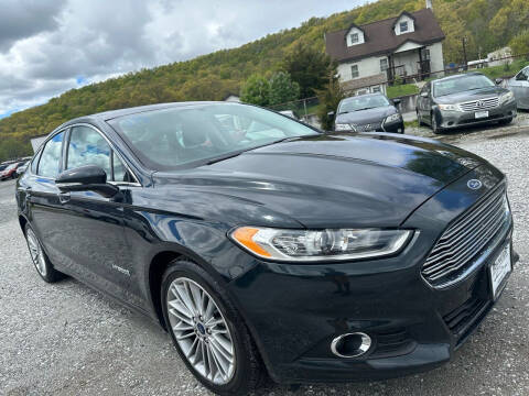 2014 Ford Fusion Hybrid for sale at Ron Motor Inc. in Wantage NJ