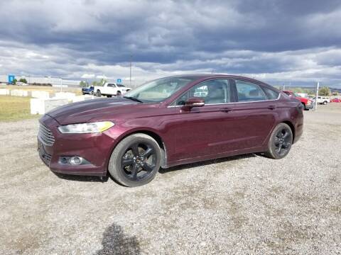 2013 Ford Fusion for sale at KHAN'S AUTO LLC in Worland WY