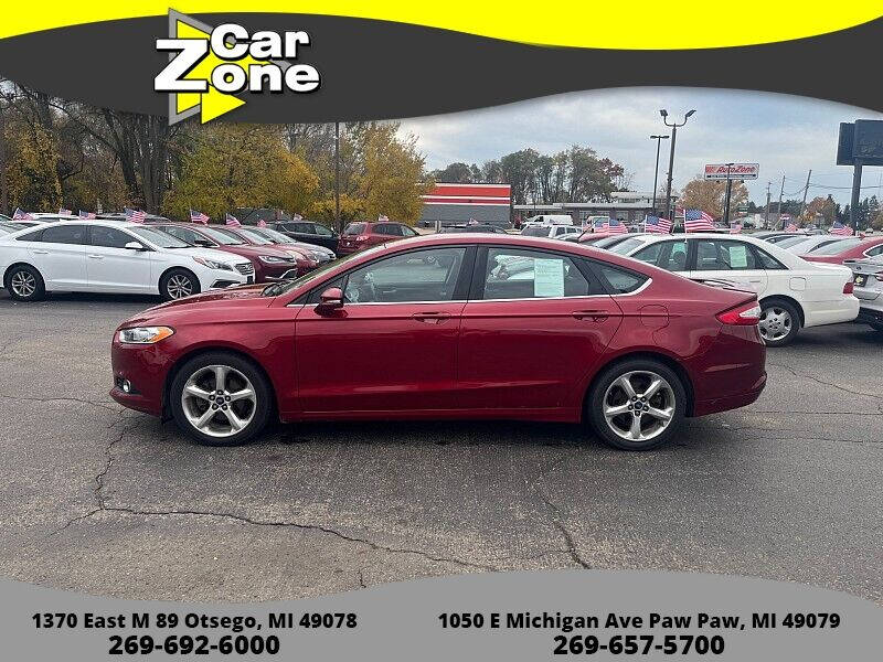 2013 Ford Fusion for sale at Car Zone in Otsego MI