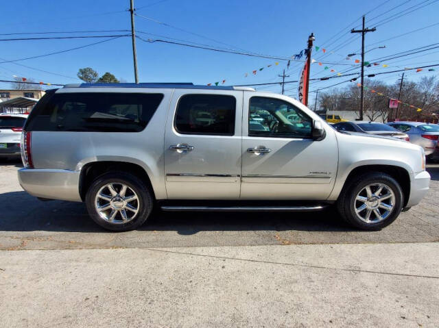 2011 GMC Yukon XL for sale at DAGO'S AUTO SALES LLC in Dalton, GA