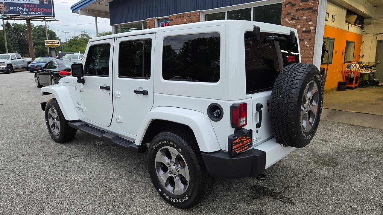 2016 Jeep Wrangler Unlimited for sale at North Ridge Auto Center LLC in Madison, OH