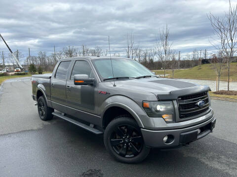 2013 Ford F-150 for sale at BOOST MOTORS LLC in Sterling VA