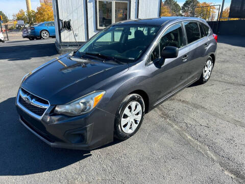 2014 Subaru Impreza for sale at McManus Motors in Wheat Ridge CO