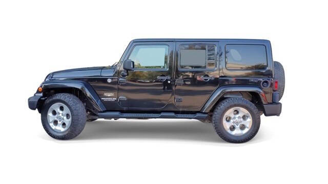 2014 Jeep Wrangler Unlimited for sale at Bowman Auto Center in Clarkston, MI