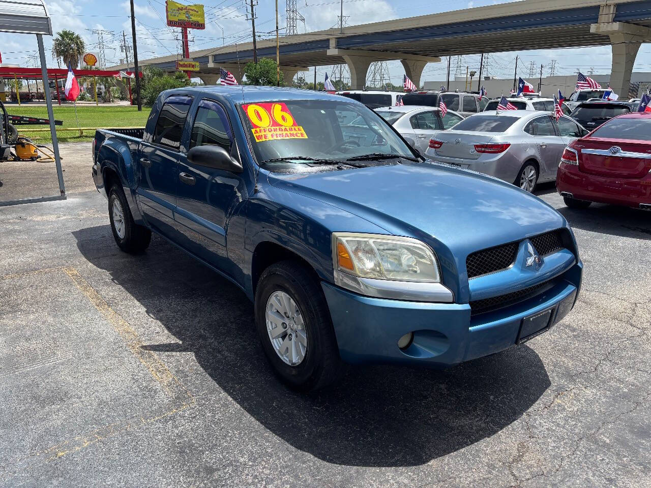 Blue 2006 Mitsubishi Raider Pickup Truck Four-Wheel Drive 4-Speed Automatic
