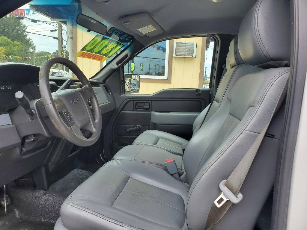 2013 Ford F-150 for sale at DAGO'S AUTO SALES LLC in Dalton, GA