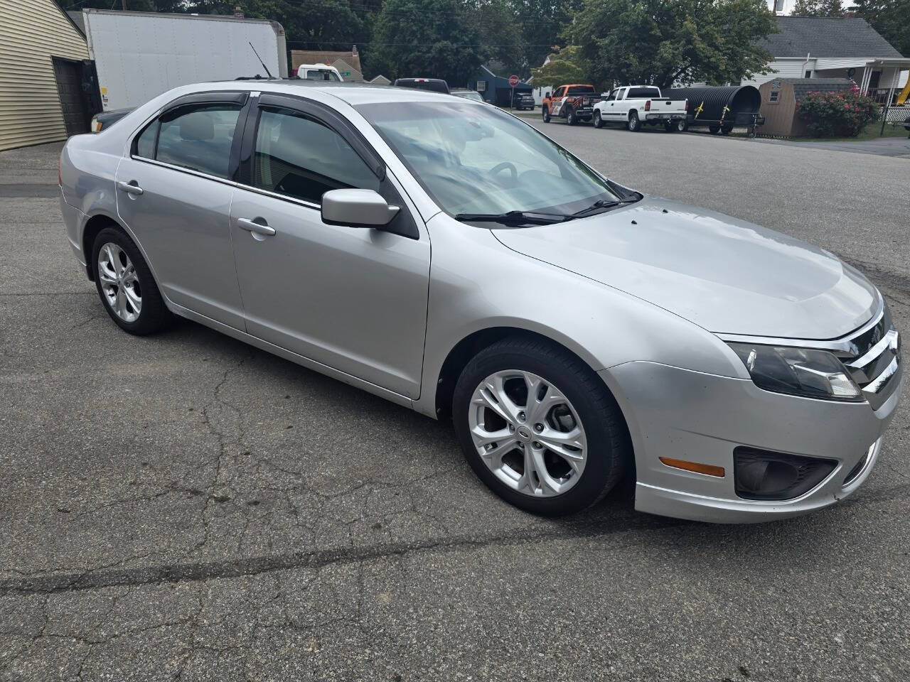 2012 Ford Fusion for sale at QUEENSGATE AUTO SALES in York, PA