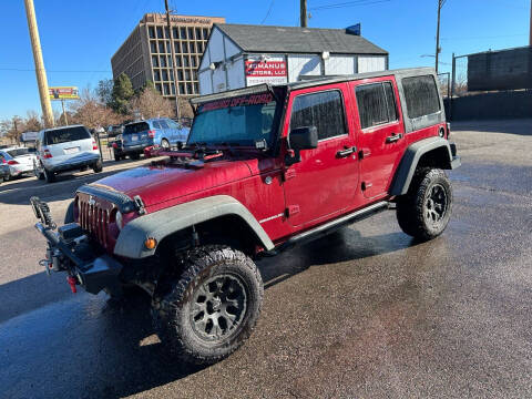 2011 Jeep Wrangler Unlimited for sale at McManus Motors in Wheat Ridge CO