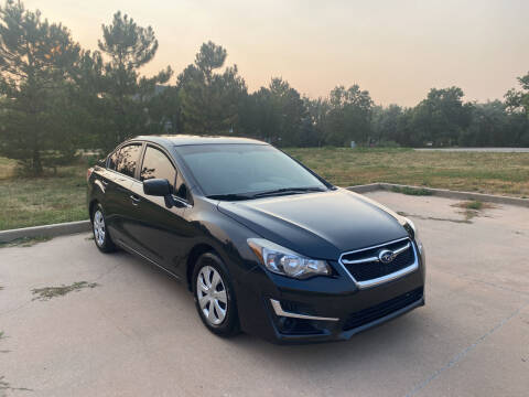 2015 Subaru Impreza for sale at QUEST MOTORS in Englewood CO