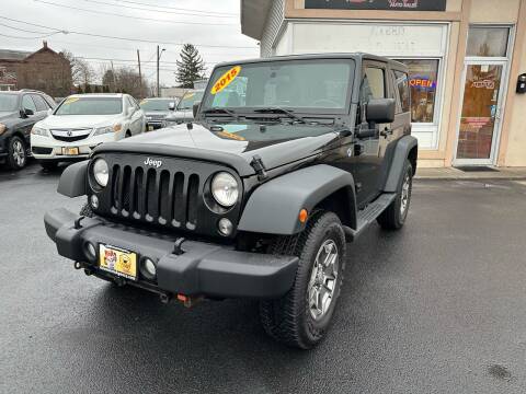 2015 Jeep Wrangler for sale at ADAM AUTO AGENCY in Rensselaer NY