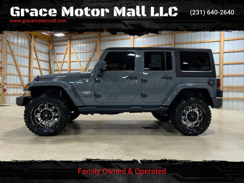 2015 Jeep Wrangler Unlimited for sale at Grace Motor Mall LLC in Traverse City MI