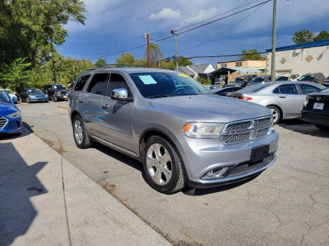 2014 Dodge Durango for sale at DAGO'S AUTO SALES LLC in Dalton, GA