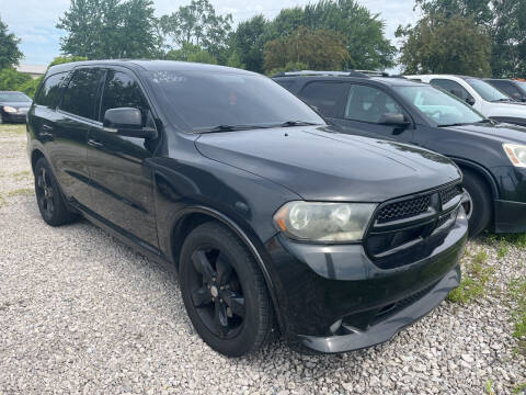 2013 Dodge Durango for sale at HEDGES USED CARS in Carleton MI