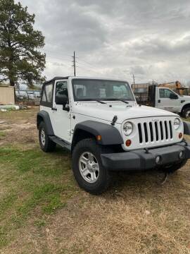 2013 Jeep Wrangler for sale at COUNTRY MOTORS in Houston TX