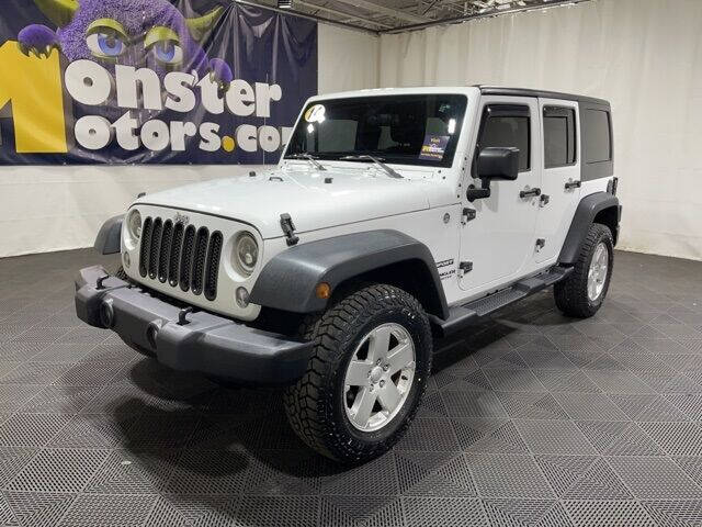 2014 Jeep Wrangler Unlimited for sale at Monster Motors in Michigan Center MI