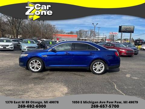 2013 Ford Taurus for sale at Car Zone in Otsego MI