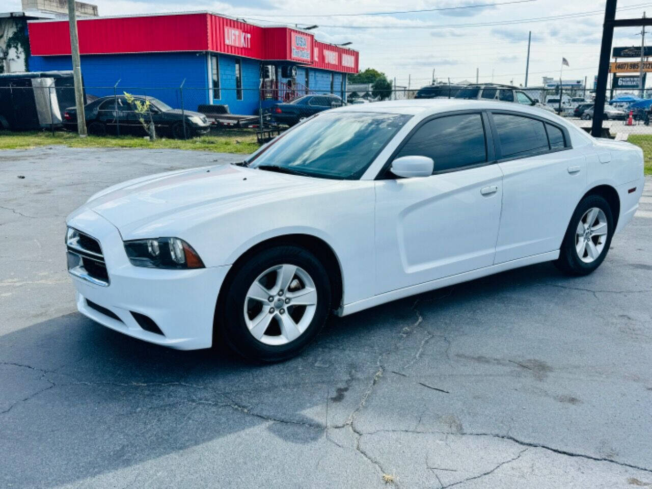 2014 Dodge Charger for sale at NOVA AUTO SALES in Orlando, FL