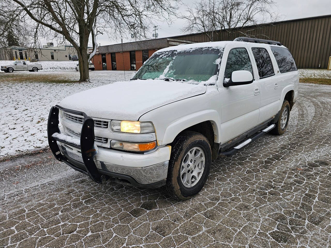 2003 Chevrolet Suburban for sale at WAGNER AUTO MART LLC in Ann Arbor, MI