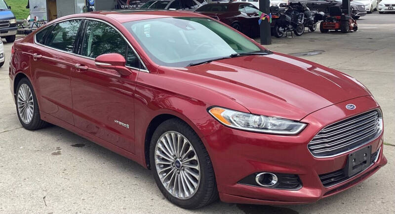 2014 Ford Fusion Hybrid for sale at DRIVE SAFE AUTO LLC in Springfield OH