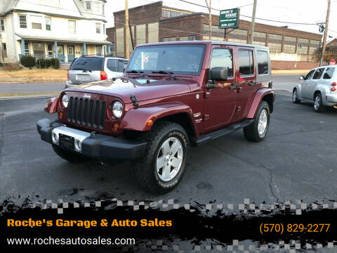 2010 Jeep Wrangler Unlimited for sale at Roche's Garage & Auto Sales in Wilkes-Barre PA