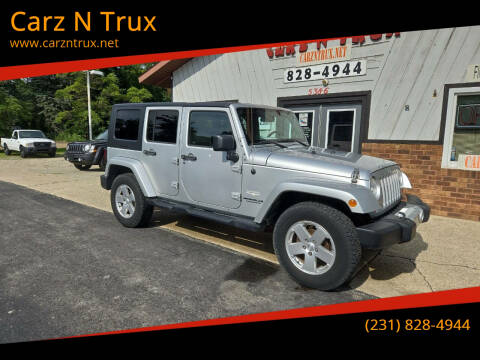 2010 Jeep Wrangler Unlimited for sale at Carz N Trux in Twin Lake MI