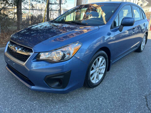 2014 Subaru Impreza for sale at D'Ambroise Auto Sales in Lowell MA