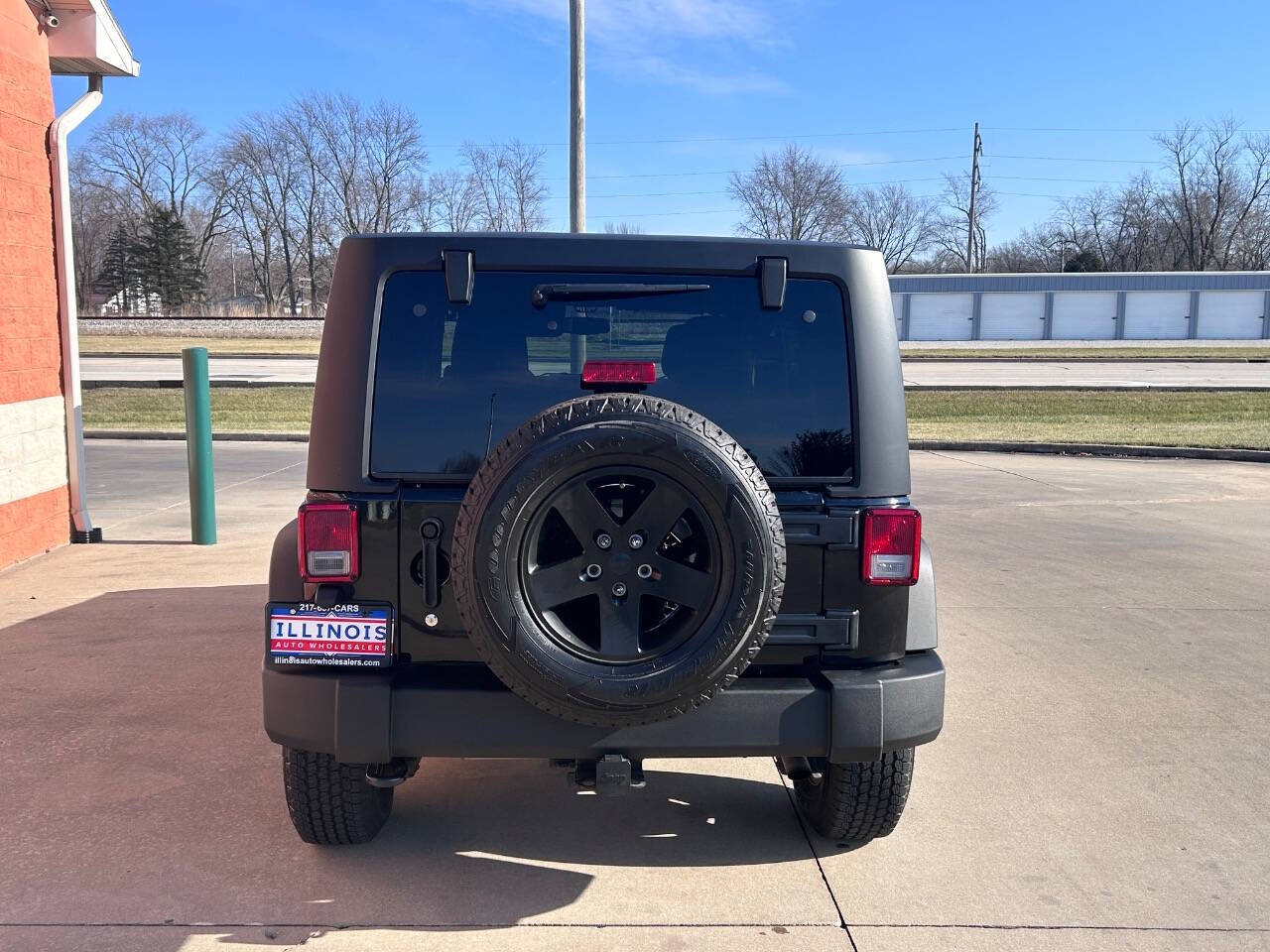 2014 Jeep Wrangler Unlimited for sale at Illinois Auto Wholesalers in Tolono, IL