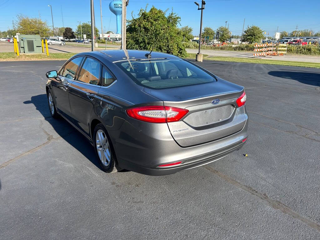 2014 Ford Fusion for sale at Wyrick Auto Sales & Leasing Inc in Zeeland, MI