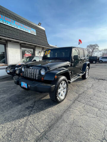2012 Jeep Wrangler Unlimited for sale at VELAZQUEZ AUTO SALES in Aurora IL
