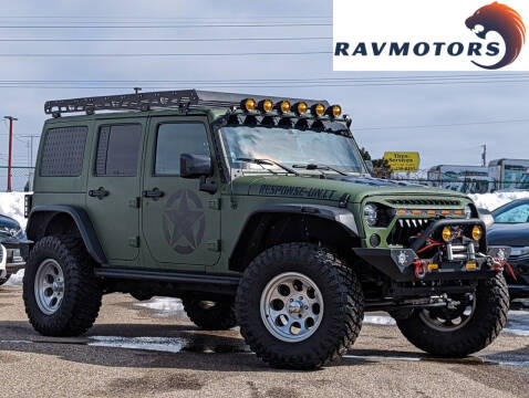 2016 Jeep Wrangler Unlimited for sale at RAVMOTORS- Burnsville in Burnsville MN