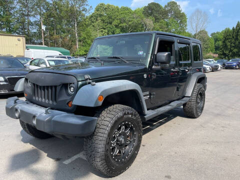 2011 Jeep Wrangler Unlimited for sale at GEORGIA AUTO DEALER LLC in Buford GA