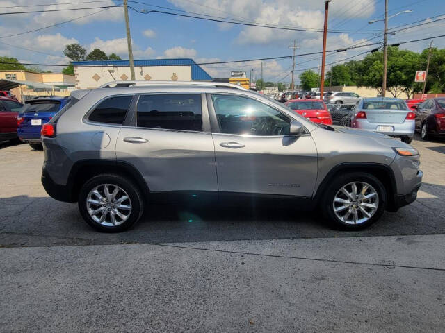 2014 Jeep Cherokee for sale at DAGO'S AUTO SALES LLC in Dalton, GA