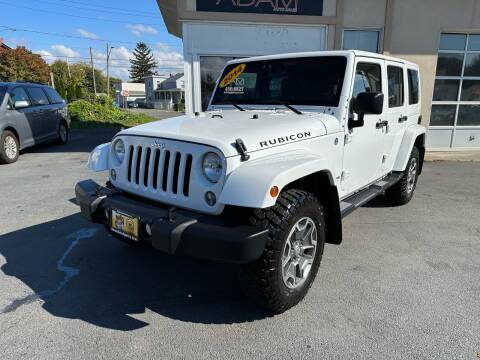 2014 Jeep Wrangler Unlimited for sale at ADAM AUTO AGENCY in Rensselaer NY