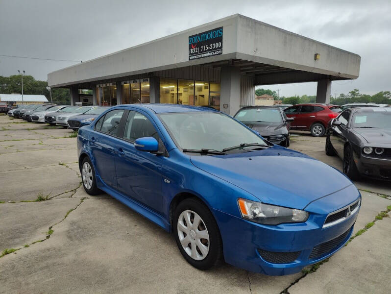 2015 Mitsubishi Lancer for sale at ZORA MOTORS in Rosenberg TX