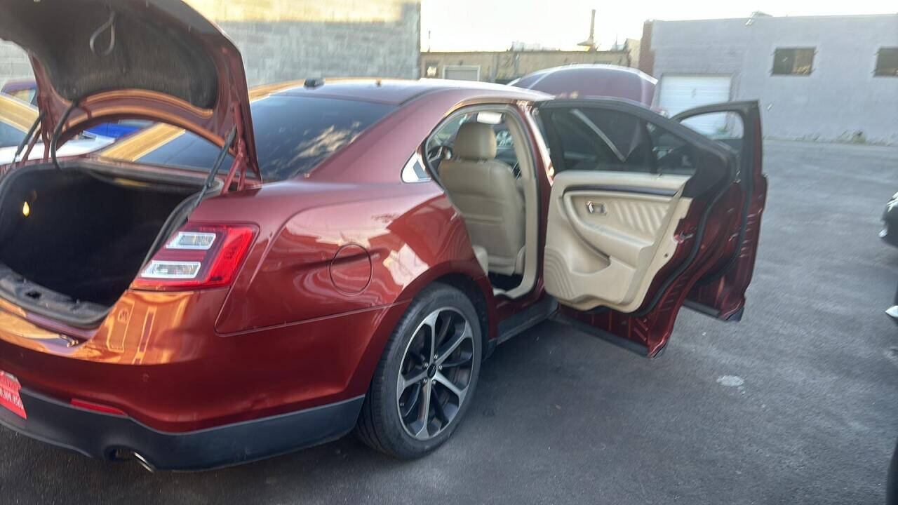 2014 Ford Taurus for sale at Ganda Auto Sales in Denver, CO