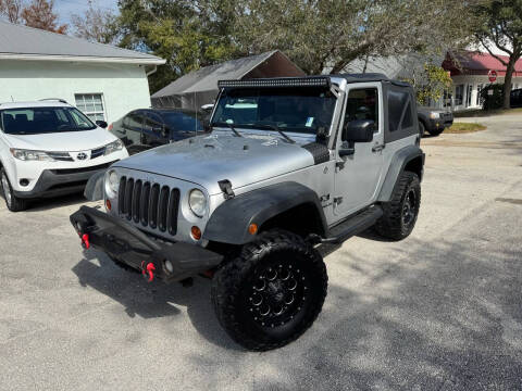 2009 Jeep Wrangler for sale at REZAUTOS in Vero Beach FL