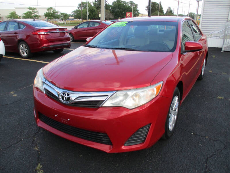 2014 Toyota Camry for sale at Ringa Auto Sales in Arlington Heights IL