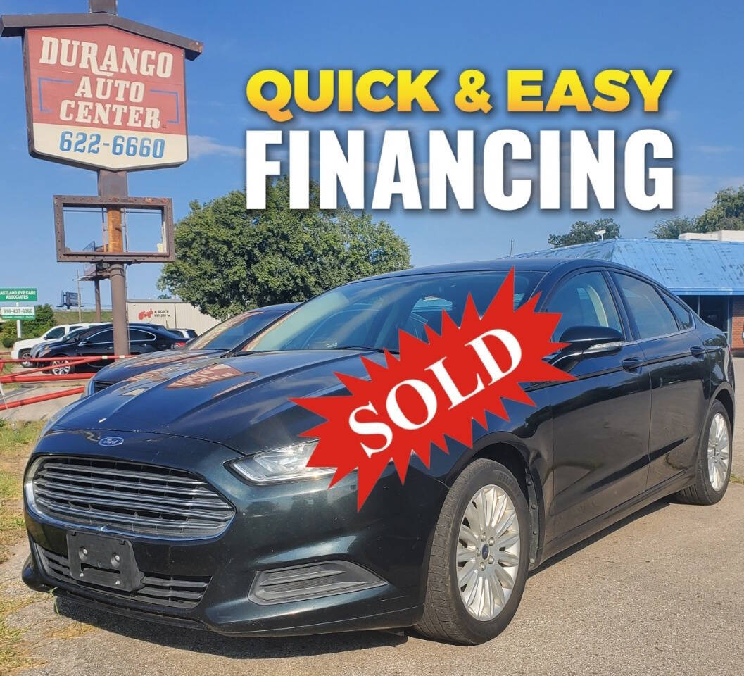 2014 Ford Fusion Hybrid for sale at DURANGO AUTO CENTER LLC in Tulsa, OK