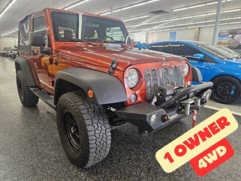 2014 Jeep Wrangler for sale at Dixie Motors in Fairfield OH