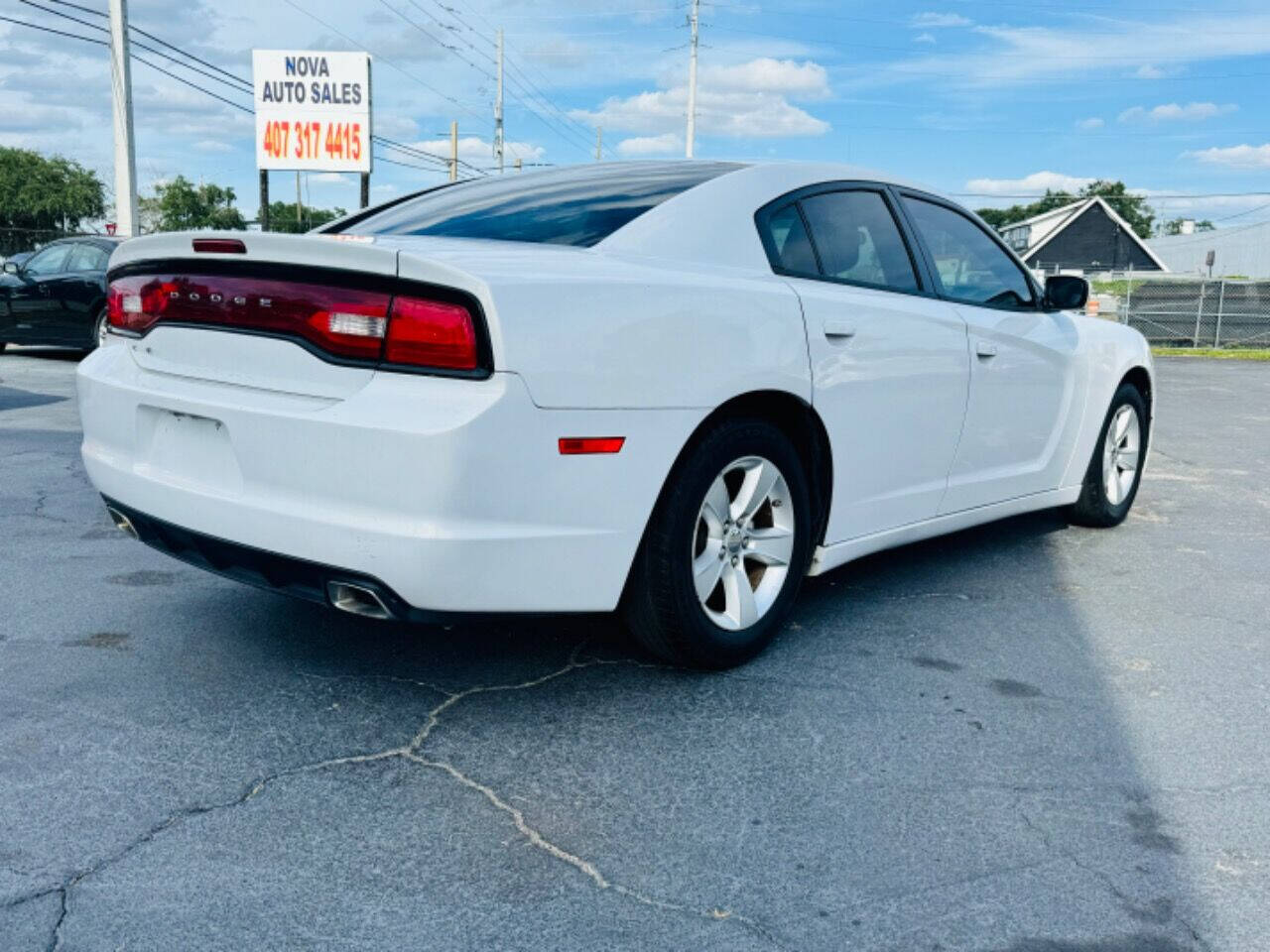 2014 Dodge Charger for sale at NOVA AUTO SALES in Orlando, FL