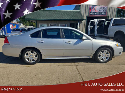 2012 Chevrolet Impala for sale at H & L AUTO SALES LLC in Wyoming MI