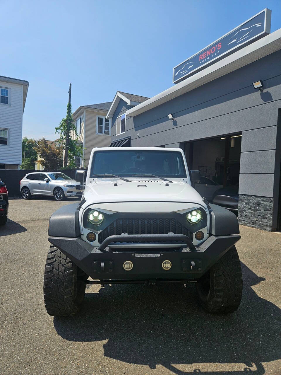 2016 Jeep Wrangler Unlimited for sale at RENOS AUTO SALES LLC in Waterbury, CT