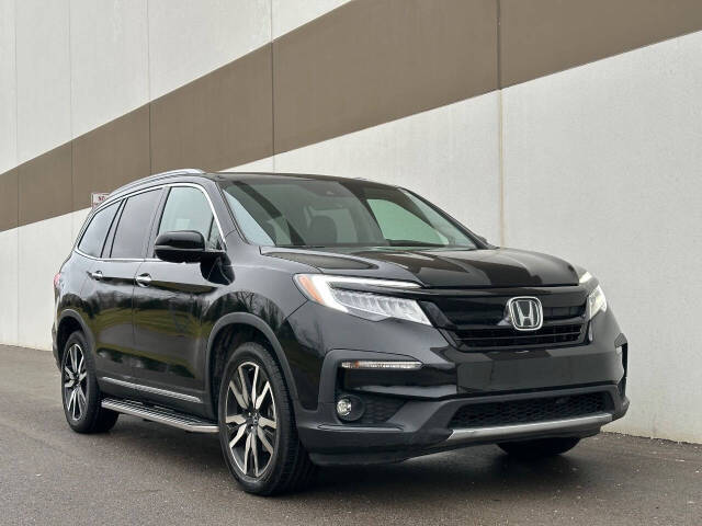 2021 Honda Pilot for sale at Phoenix Motor Co in Romulus, MI