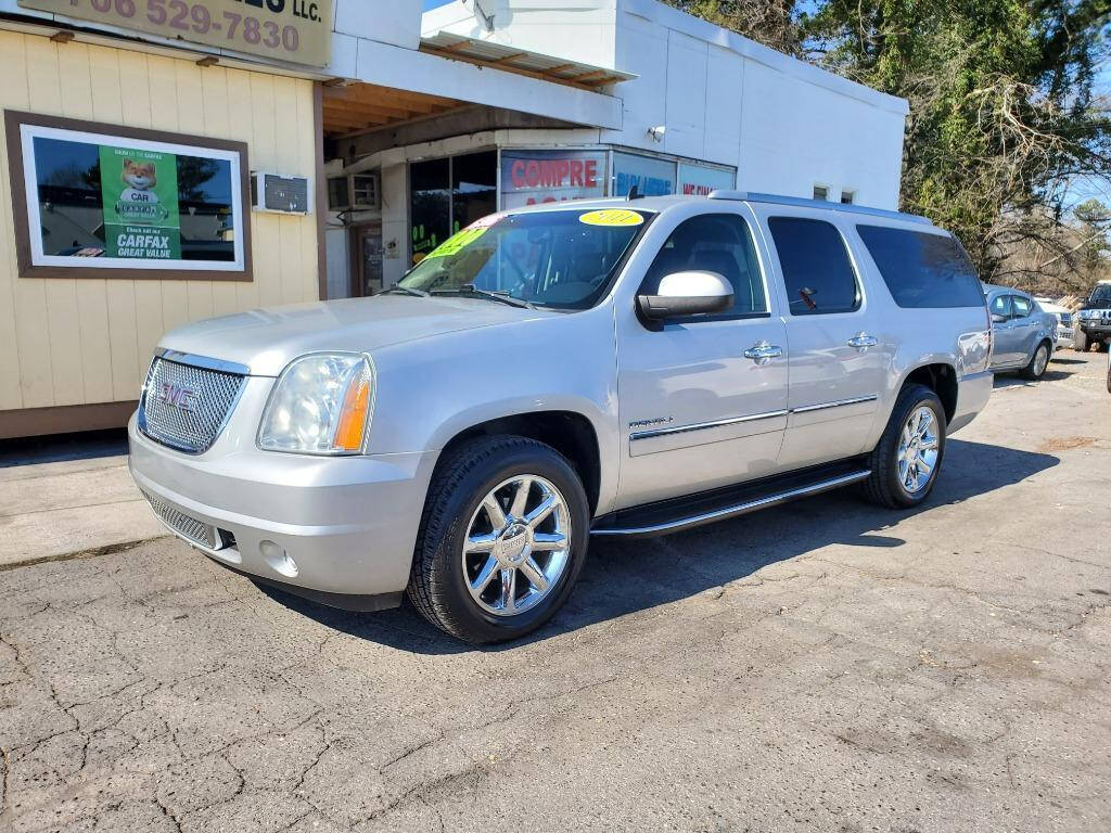 2011 GMC Yukon XL for sale at DAGO'S AUTO SALES LLC in Dalton, GA