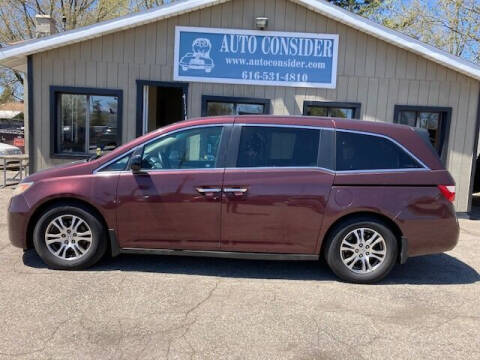 2012 Honda Odyssey for sale at Auto Consider Inc. in Grand Rapids MI