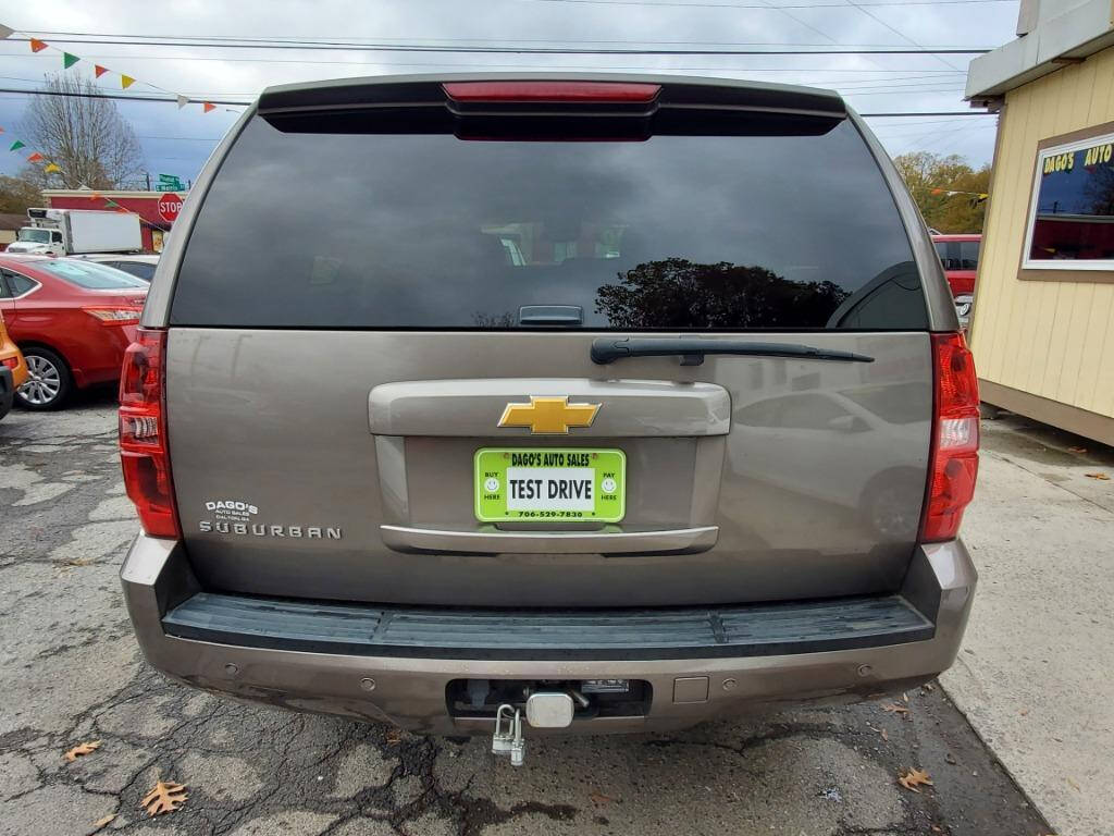 2013 Chevrolet Suburban for sale at DAGO'S AUTO SALES LLC in Dalton, GA