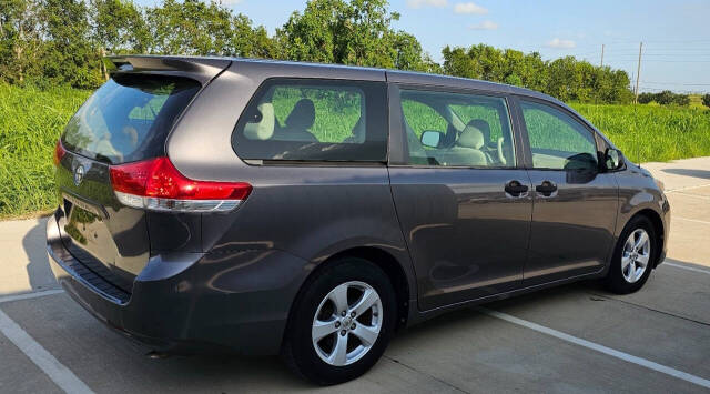 2014 Toyota Sienna for sale at CAR MARKET AUTO GROUP in Sugar Land, TX